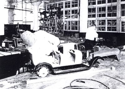 Craftsmen from the Nordyke & Marmon Company work on a 1/4 scale Marmon model.