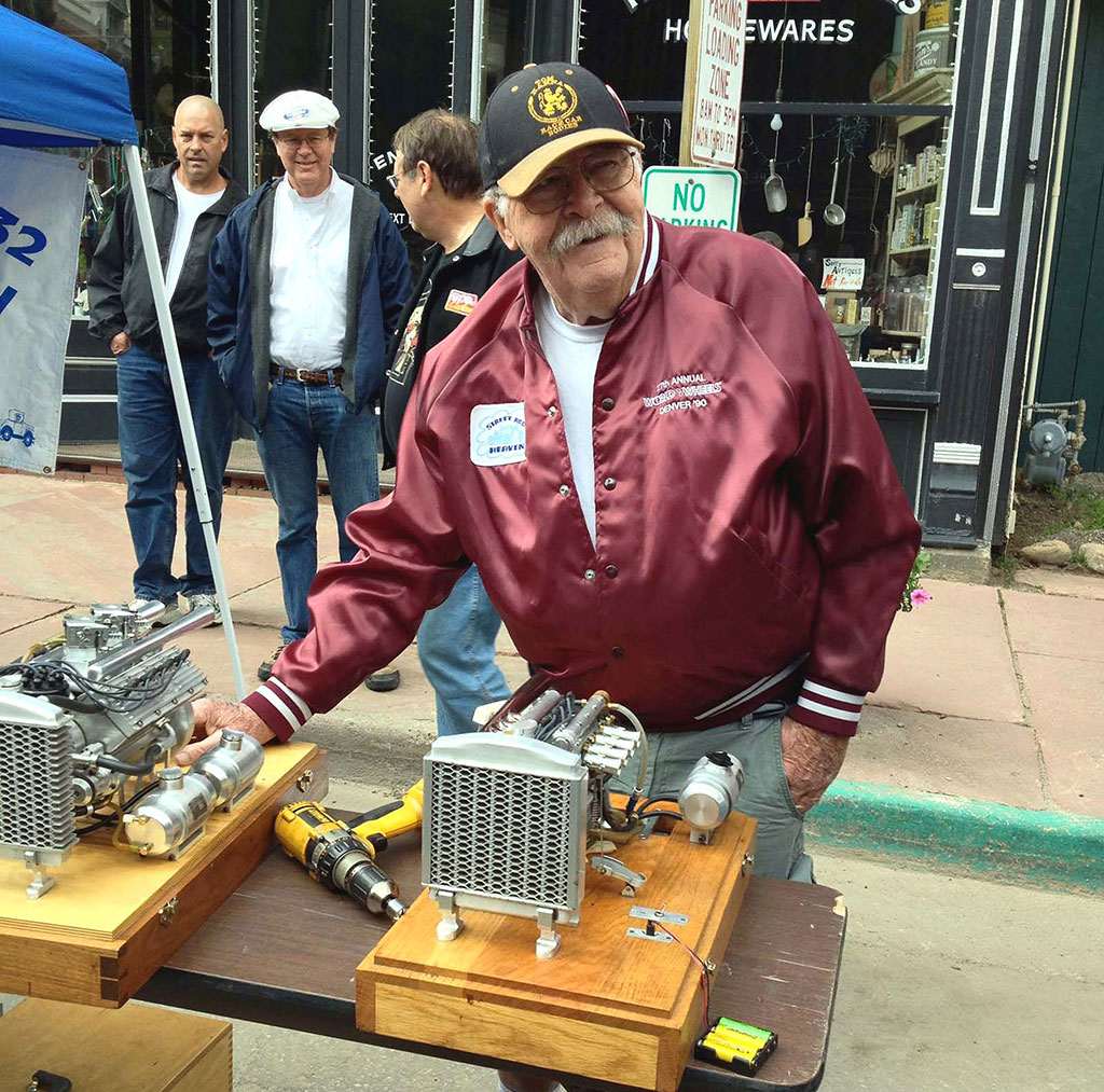 Ron Bement with a few engines on display.