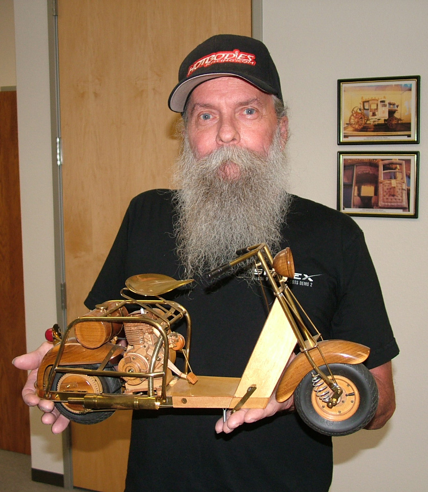 Daniel "Buzz" Brunkow with his 1/4 scale model Cushman 711 scooter.