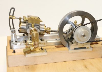 This miniature punch press can be driven by the accompanying launch engine.