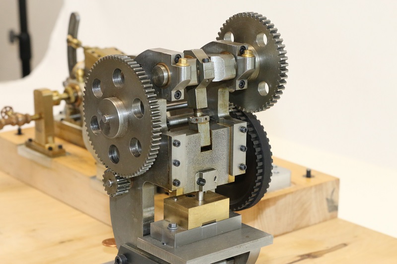 Miniature punch press and launch engine. 