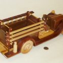 A wooden toy model fire truck built by George Russell.