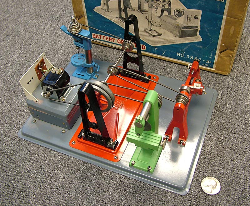 A miniature electric diecast toy machine shop made by AHI.