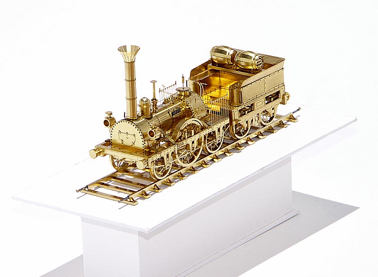 A very delicate brass sculpture of the 1835 Adler steam locomotive and tender.