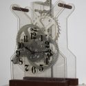 This Plexiglas framed pendulum wall clock was made with aluminum gears.