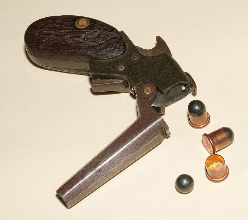 A miniature .22 single shot pistol.