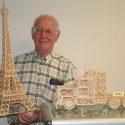 Ron Remsberg with his matchstick models of the Eiffel Tower and a semi-truck. 