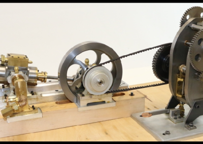 This miniature punch press can be driven by the accompanying launch engine.