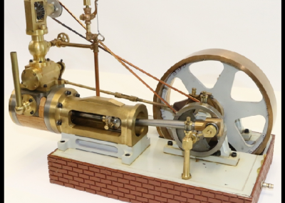 A miniature rocking valve engine built by Theodore Carder.