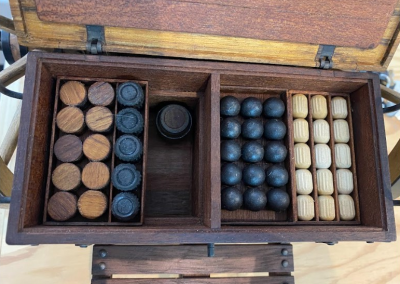 Lifting the lid on the ammunition box reveals an arsenal of miniature munitions.