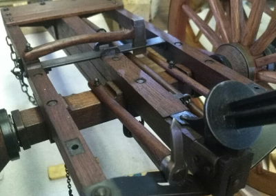 The underside of the caisson ammunition cart is shown here. The 1/6 scale cart includes a spare wheel, an axe, a shovel, a mattock, and a spare cart pole slung underneath.