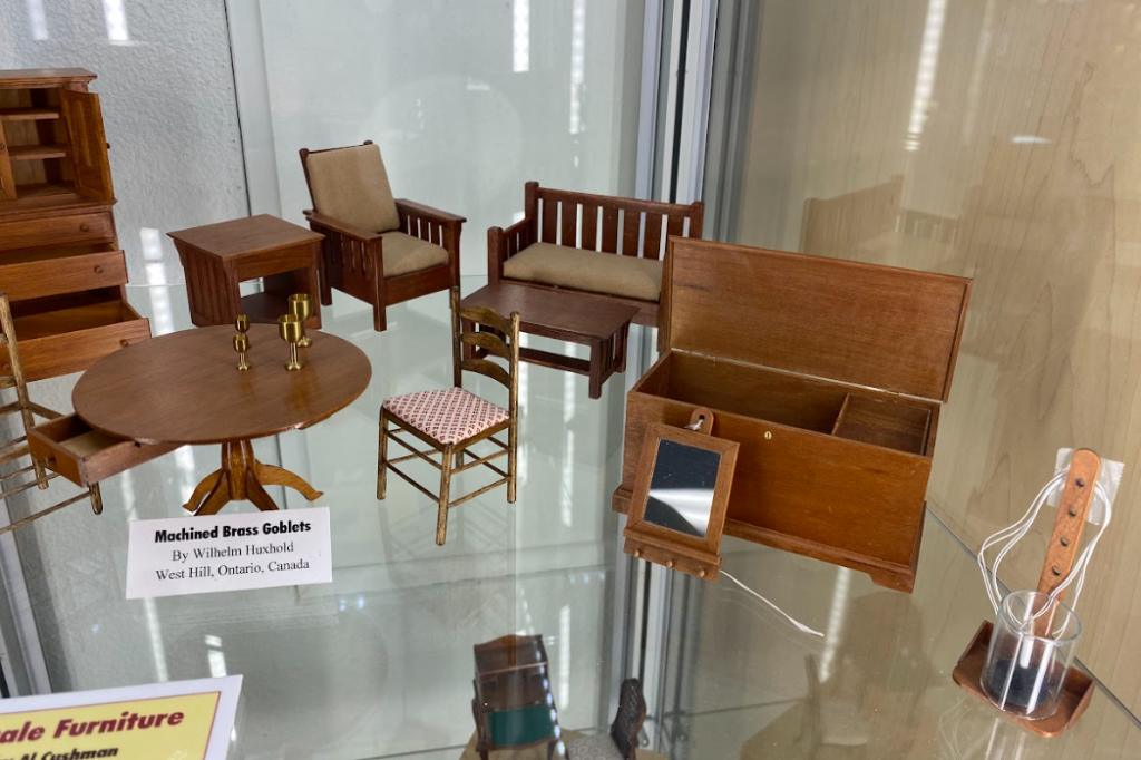 Several pieces of fine 1/12 scale miniature furniture crafted by Al Cushman.