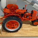 This 1/12 scale diecast Case SC tractor was produced by Franklin Mint.