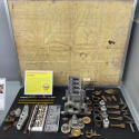 An unassembled casting kit for an Elmer Wall 4-cylinder water-cooled gas engine kit.
