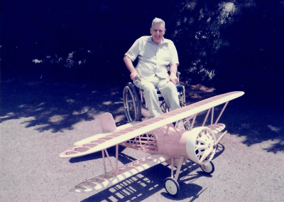 Dan is seated behind his F4B-2 biplane before the R/C model was fully completed.