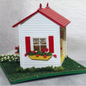 This 1/4”-scale playhouse was built by Peggy Boggeln during a class at a NAME National Convention.