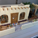 This 1/2”-scale adobe style dollhouse is titled, “Mi Casa.”