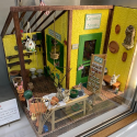 This 1”-scale dollhouse room is titled “Growth Spurts.”