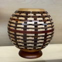 Eckhard Fadtke handcrafted this ornate open segmented wooden sphere vase.